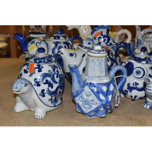 845 - A COLLECTION OF TWENTY-THREE NOVELTY TEAPOTS to include six blue and white animal-shaped teapots com... 