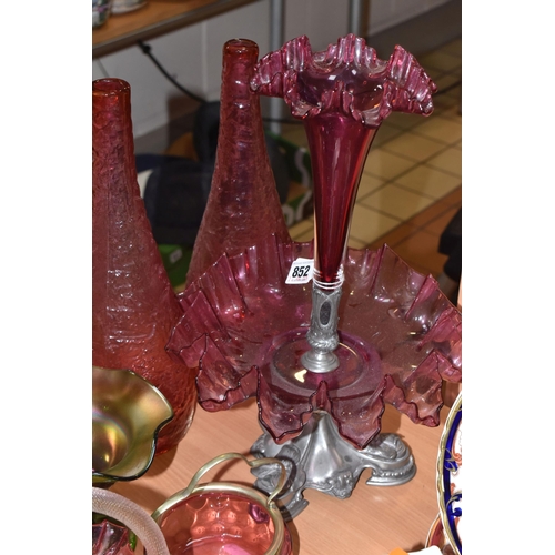 852 - A GROUP OF MOSTLY CRANBERRY GLASS to include a single trumpet cranberry glass epergne, possibly Carr... 