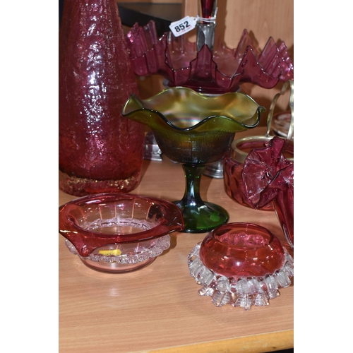 852 - A GROUP OF MOSTLY CRANBERRY GLASS to include a single trumpet cranberry glass epergne, possibly Carr... 