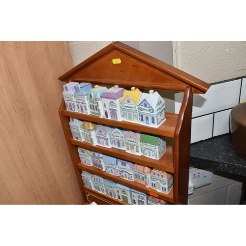 861 - A 'BROOKS AND BENTLEY' SPICE RACK, TEA POT, AND CONDIMENT SERVING TRAY comprising a wooden wall-moun... 