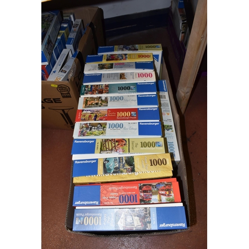 880 - FIVE BOXES OF JIGSAW PUZZLES, approximately fifty puzzles various themes to include gardening, count... 