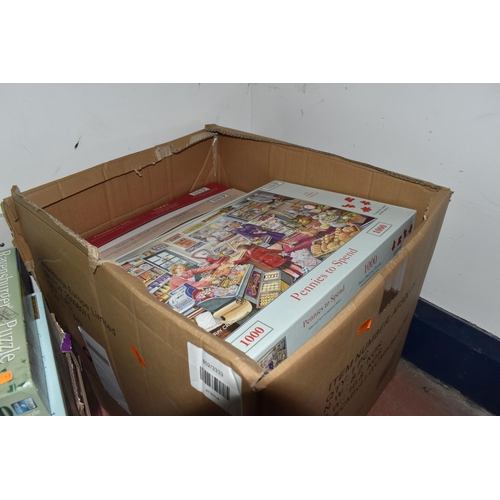 880 - FIVE BOXES OF JIGSAW PUZZLES, approximately fifty puzzles various themes to include gardening, count... 