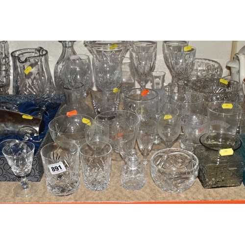 891 - A QUANTITY OF MIXED GLASSWARES to include two Dartington square-based glass vases in blue and smoky ... 