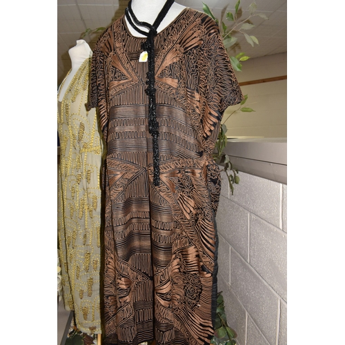 900 - THREE 1920'S/1930'S VINTAGE DRESSES, comprising a black silk dress with copper coloured machine embr... 