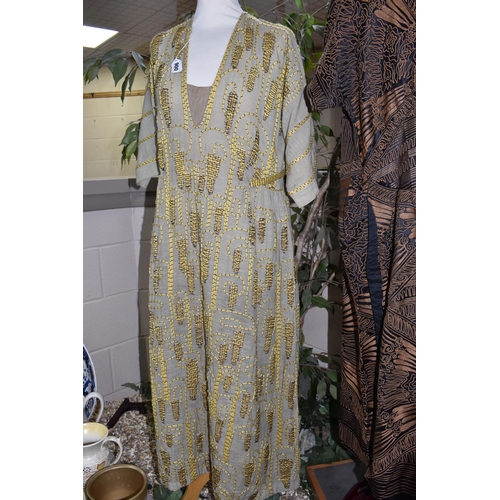 900 - THREE 1920'S/1930'S VINTAGE DRESSES, comprising a black silk dress with copper coloured machine embr... 