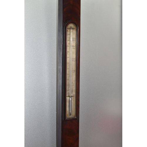 822 - A GEORGIAN CISTERN BAROMETER, in flame cut mahogany, the arched glass door enclosing a face signed '... 