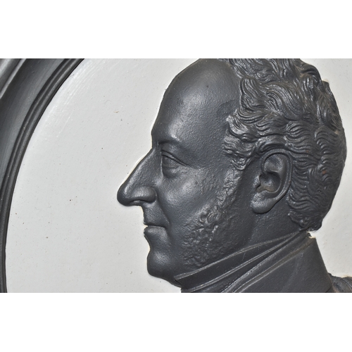 830 - A CAST IRON PORTRAIT WALL PLAQUE, bearing a relief moulded side profile of Prince Albert, within a d... 