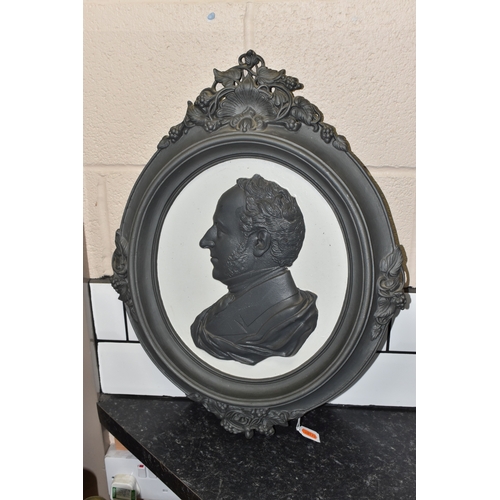 830 - A CAST IRON PORTRAIT WALL PLAQUE, bearing a relief moulded side profile of Prince Albert, within a d... 