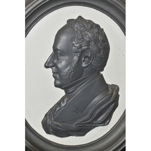 830 - A CAST IRON PORTRAIT WALL PLAQUE, bearing a relief moulded side profile of Prince Albert, within a d... 