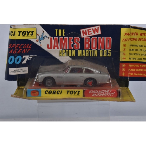 49 - A BOXED CORGI TOYS JAMES BOND ASTON MARTIN D.B.5, No.270, appears complete with all working features... 