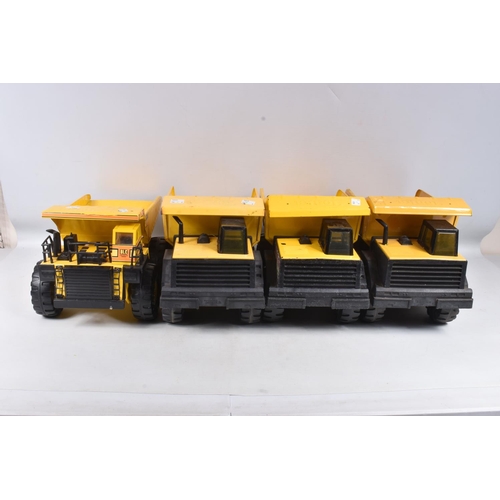 109 - THREE MIGHTY TONKA TOYS DUMPER TRUCKS, three are the later versions with plastic chassis, with a sim... 