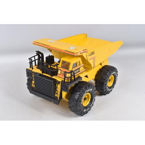 109 - THREE MIGHTY TONKA TOYS DUMPER TRUCKS, three are the later versions with plastic chassis, with a sim... 