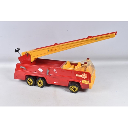 112 - TWO TONKA TOYS AERIAL LADDER FIRE TRUCKS, both ladders raise and lower, one has working extension la... 