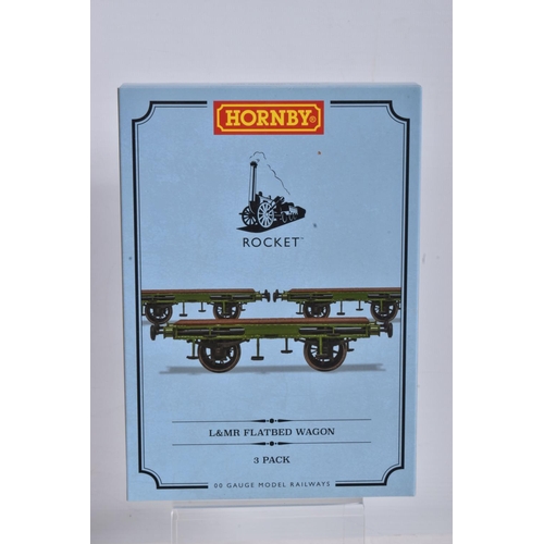 124 - A COLLECTION OF BOXED HORNBY OO GAUGE TRAIN PACKS, to include a Stephenson's Rocket Train Pack Era 1... 