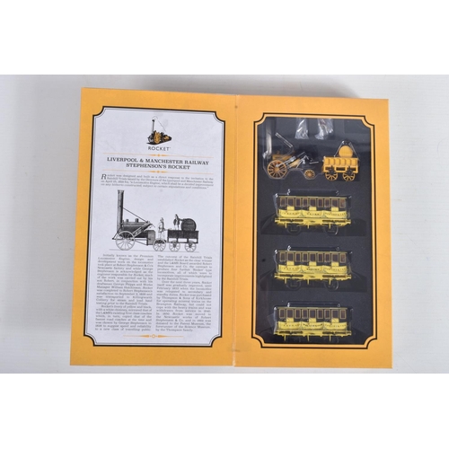 124 - A COLLECTION OF BOXED HORNBY OO GAUGE TRAIN PACKS, to include a Stephenson's Rocket Train Pack Era 1... 