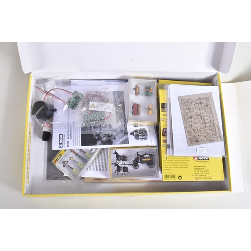 138 - A COLLECTION OF BOXED MODEL RAILWAY HO GAUGE SCENERY, to include a Noch Limited Edition Haunted Hous... 