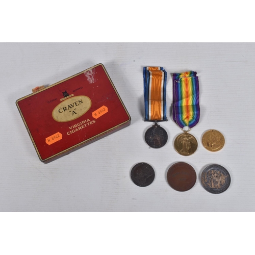 210 - A WWI CASUALTY PAIR OF MEDALS AND MEMORIAL PLAQUE, the medals are named to 102477 Private H Guest M.... 