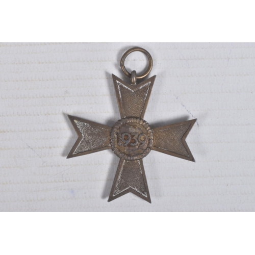 229 - A GERMAN WWII ERA WAR MERIT CROSS AND A CLOSE COMBAT MEDAL, the War Merit Cross is missing a ribbon ... 