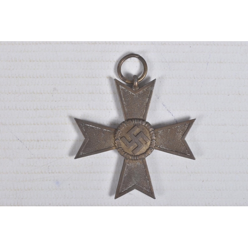 229 - A GERMAN WWII ERA WAR MERIT CROSS AND A CLOSE COMBAT MEDAL, the War Merit Cross is missing a ribbon ... 