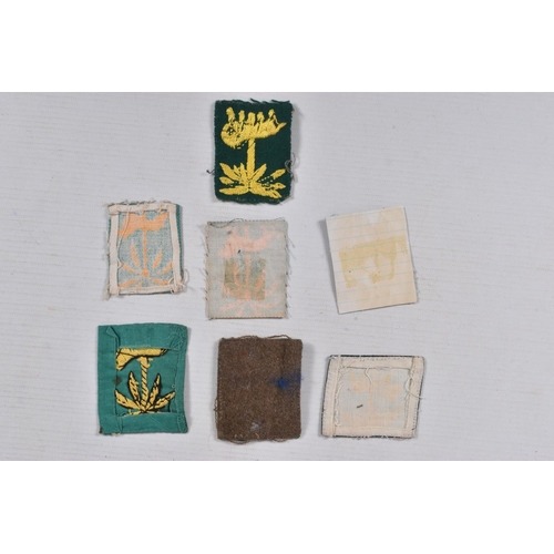 230 - A SMALL NUMBER(7) SINGAPORE DISTRICT WW2 ERA ARM PATCHES, either woven or printed