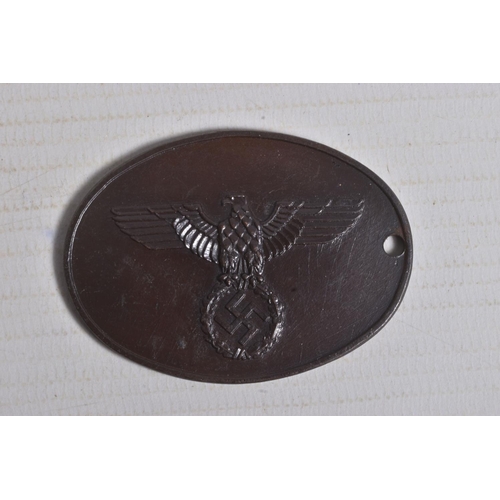 240 - A GERMAN GESTAPO IDENTITY DISC NUMBERED 3881