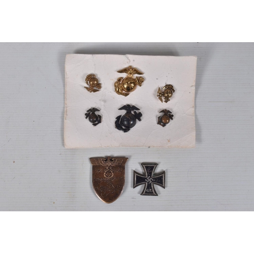 248 - A SMALL COLLECTION OF WWII OR LATER UNITED STATES of AMERICA  MARINES BADGES along with a German Iro... 