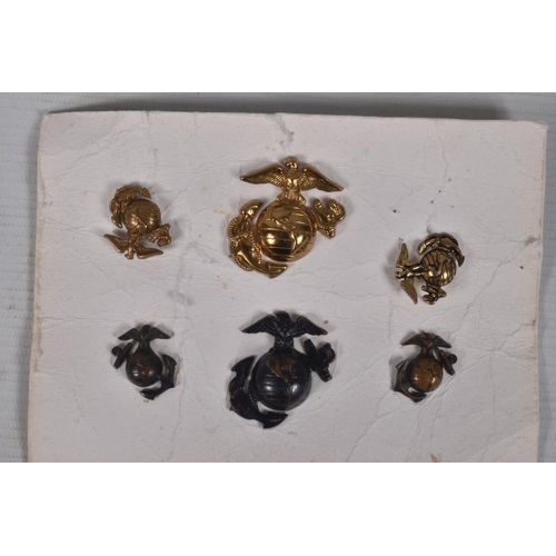 248 - A SMALL COLLECTION OF WWII OR LATER UNITED STATES of AMERICA  MARINES BADGES along with a German Iro... 