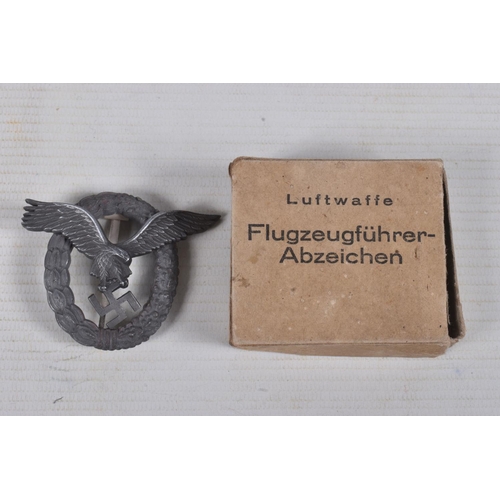 254 - A GERMAN LUFTWAFFE PILOTS BADGE WITH A CARDBOARD BOX, the badge is a 2 piece construction with the e... 