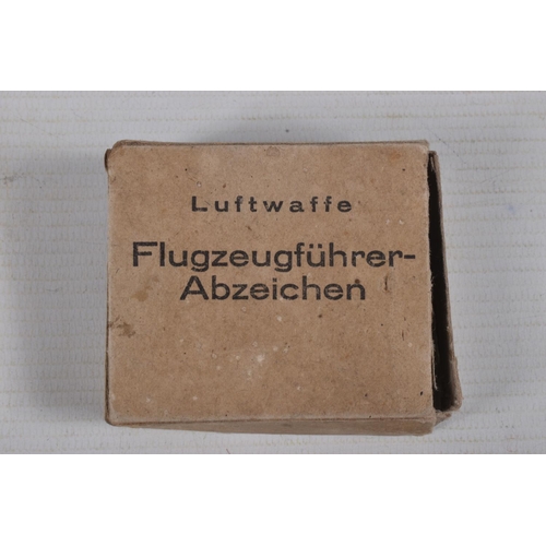 254 - A GERMAN LUFTWAFFE PILOTS BADGE WITH A CARDBOARD BOX, the badge is a 2 piece construction with the e... 