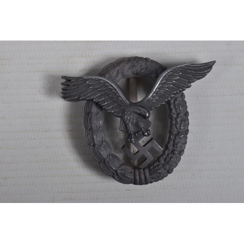 254 - A GERMAN LUFTWAFFE PILOTS BADGE WITH A CARDBOARD BOX, the badge is a 2 piece construction with the e... 