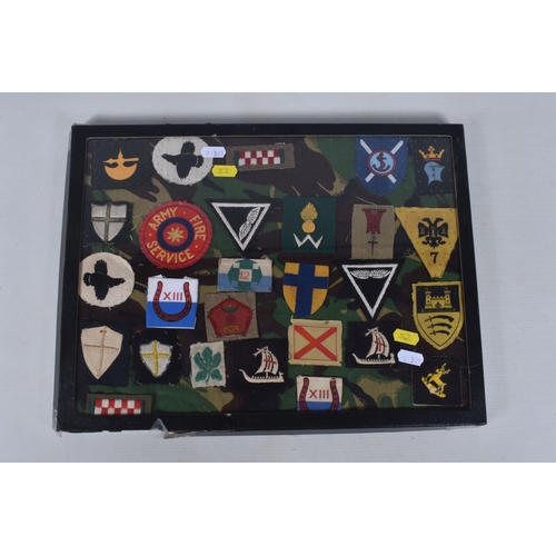 266 - RIKER FRAME CONTAINING AN ACCUMULATION OF BRITISH ARMY SHOULDER FORMATION PATCHES WW2 PERIOD, to inc... 