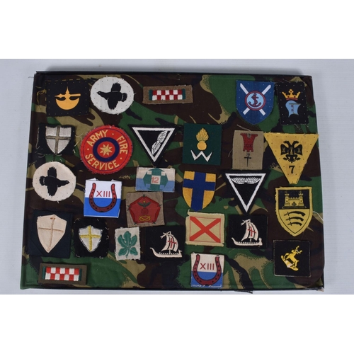 266 - RIKER FRAME CONTAINING AN ACCUMULATION OF BRITISH ARMY SHOULDER FORMATION PATCHES WW2 PERIOD, to inc... 