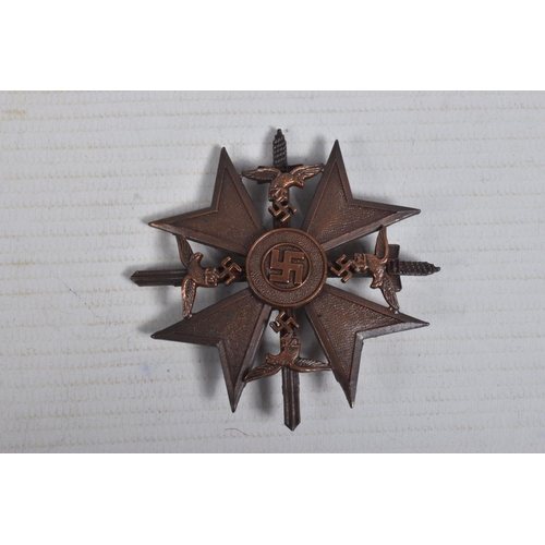 274 - A WAR ERA GERMAN SPANISH CROSS WITH CROSSED SWORDS, this is the bronze version and has a makers mark... 