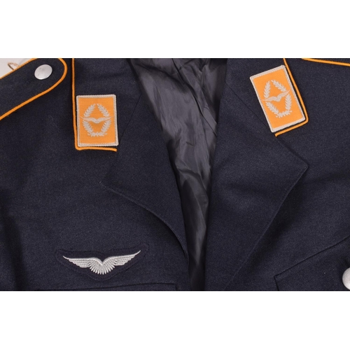 282 - TWO 1950's OR LATER GERMAN MILITARY OFFICERS JACKETS, the first jacket is grey in colour and on the ... 