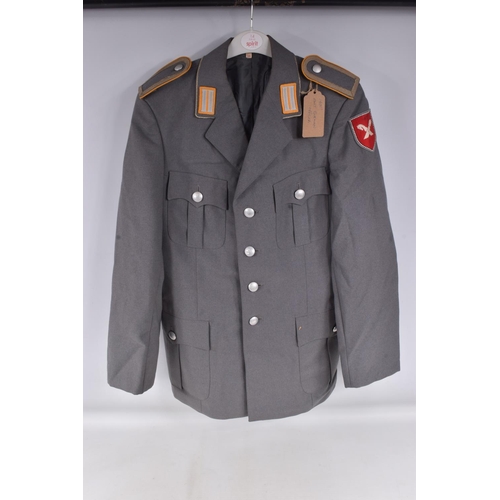 282 - TWO 1950's OR LATER GERMAN MILITARY OFFICERS JACKETS, the first jacket is grey in colour and on the ... 