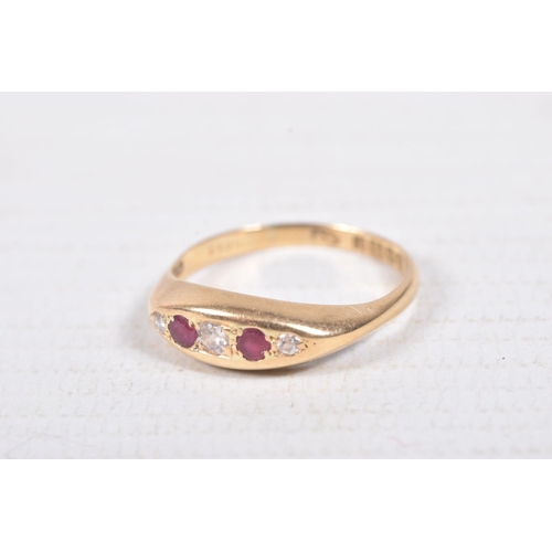 303 - AN 18CT GOLD RUBY AND DIAMOND BOAT RING, set with three old cut diamonds interspaced with two circul... 