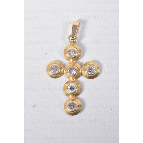 313 - A YELLOW METAL CUBIC ZIRCONIA CROSS PENDANT, set with six circular cut cubic zirconia stones, fitted... 