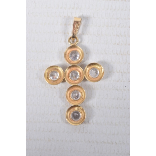 313 - A YELLOW METAL CUBIC ZIRCONIA CROSS PENDANT, set with six circular cut cubic zirconia stones, fitted... 