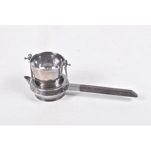 323 - A 'GARRARD & CO' SILVER TEA STRAINER, fitted with a wooden handle, hallmarked 'Garrard & Co Ltd' Lon... 