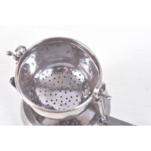 323 - A 'GARRARD & CO' SILVER TEA STRAINER, fitted with a wooden handle, hallmarked 'Garrard & Co Ltd' Lon... 