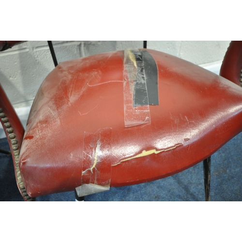 151 - A HARLEQUIN SET OF FOUR RED LEATHERETTE ARMCHAIRS, with a curved backrest, open armrests with brass ... 