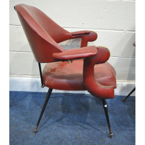 151 - A HARLEQUIN SET OF FOUR RED LEATHERETTE ARMCHAIRS, with a curved backrest, open armrests with brass ... 