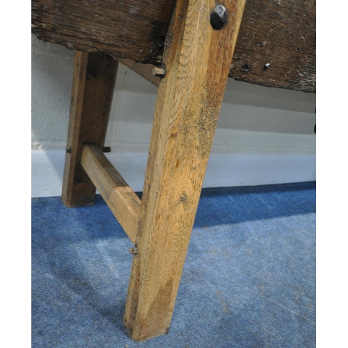 152 - A CATTLE TROUGH, with various alterations and timbers, later legs, with a cattle guard, length 202cm... 