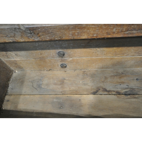 152 - A CATTLE TROUGH, with various alterations and timbers, later legs, with a cattle guard, length 202cm... 