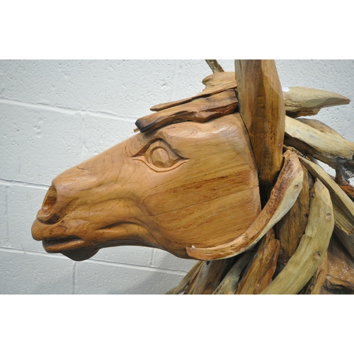 153 - A LARGE DECORATIVE DRIFTWOOD HORSE HEAD, on a plinth, height 102cm, condition report: signs of damp,... 