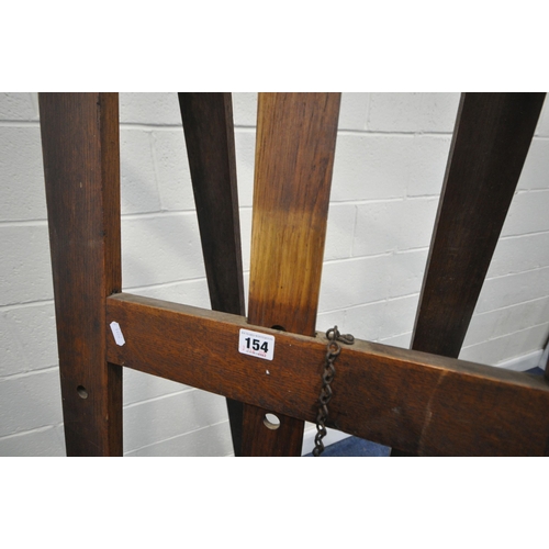 154 - A 20TH CENTURY OAK ARTIST EASEL, with a height adjustable rest, maximum height 244cm x minimum heigh... 