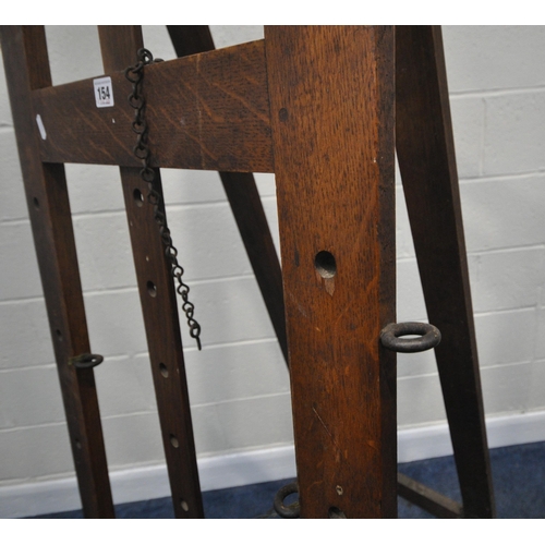 154 - A 20TH CENTURY OAK ARTIST EASEL, with a height adjustable rest, maximum height 244cm x minimum heigh... 