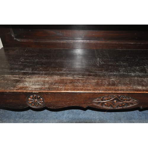 155 - AN EARLY 20TH CENTURY OAK BUFFET, fitted with two drawers, over double cupboard doors, raised on tur... 