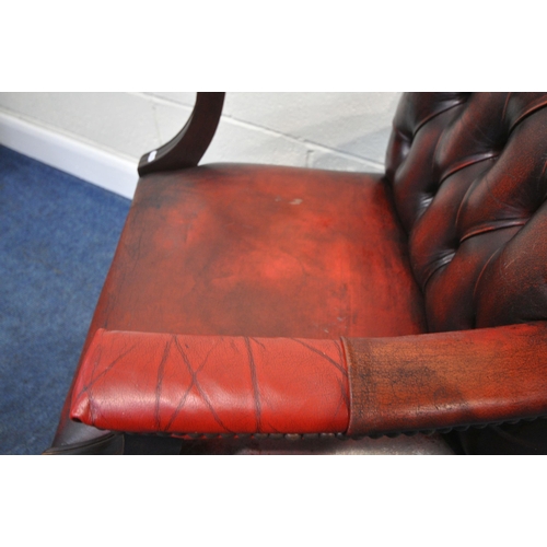 163 - A RED LEATHER BUTTON BACK GAINSBOROUGH CHAIR, with open armrests, width 55cm x depth 65cm x height 9... 