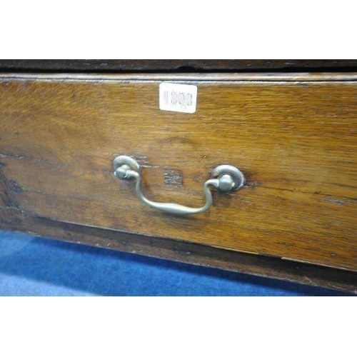 167 - A GEORGIAN AND LATER OAK DRESSER BASE, fitted with three drawers, raised on turned front legs, lengt... 